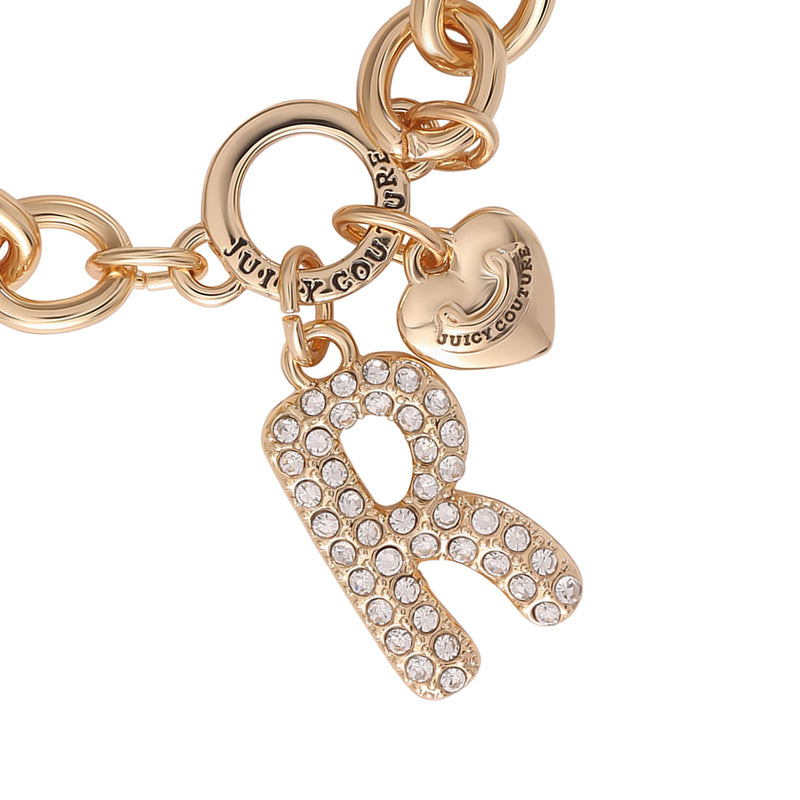Introducing the Pavé Initial Charm Bracelet, Letter R—a stunning gold chain bracelet featuring a crystal-studded letter R charm and a gold heart engraved with Juicy Couture, perfect for lovers of chic charm jewelry.