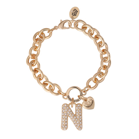 Introducing the Pavé Initial Charm Bracelet, Letter N: a gold chunky design bracelet adorned with a sparkling, rhinestone-studded letter N charm, complemented by a petite heart and round tag near the clasp—this statement piece captures the playful essence of Juicy Couture’s iconic bracelet style, perfect for lovers of bold charm jewelry.