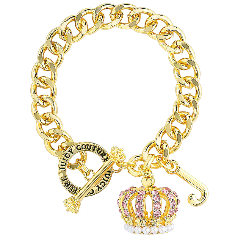 The Crown Charm Toggle Bracelet features a gold chain with a toggle clasp, Juicy Couture text, and a dangling crown charm adorned with pink and white gemstones—making it the perfect Y2K accessory to elevate any look.
