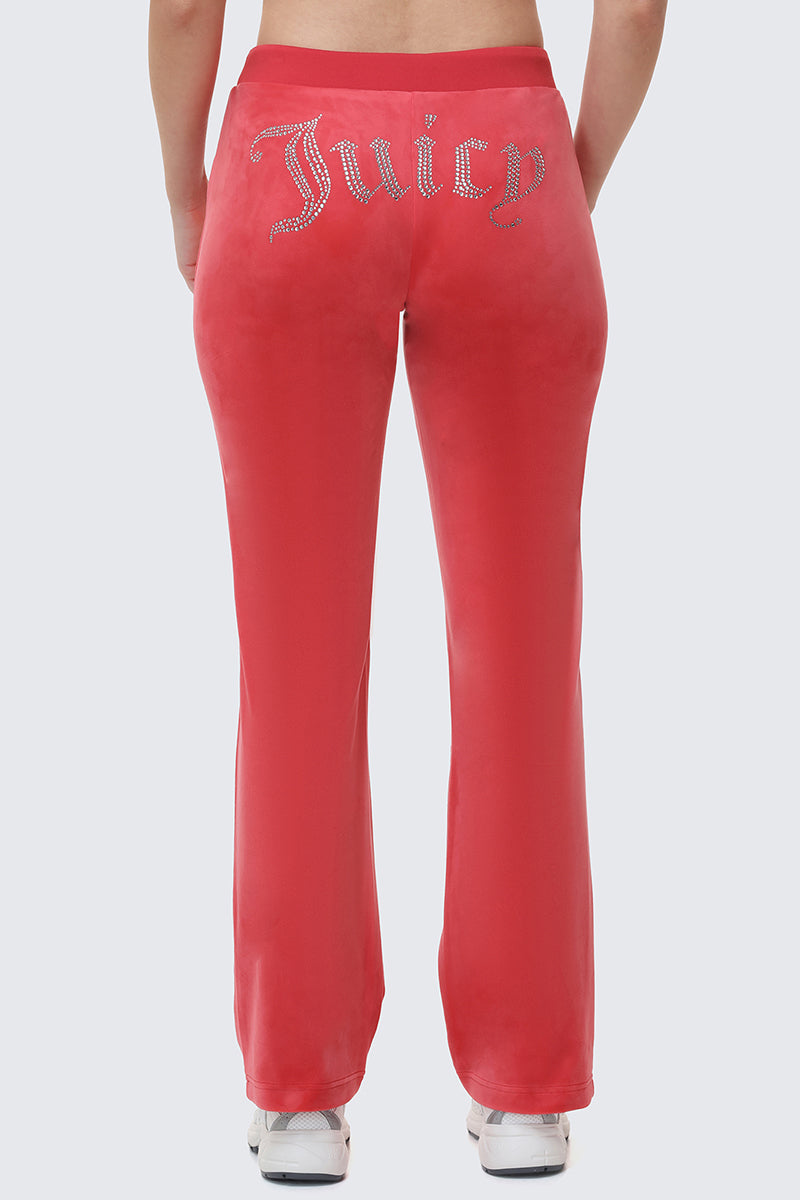 Back view of red OG Big Bling Velour Track Pants with the word Juicy spelled out in rhinestones across the seat in a classic Y2K style.