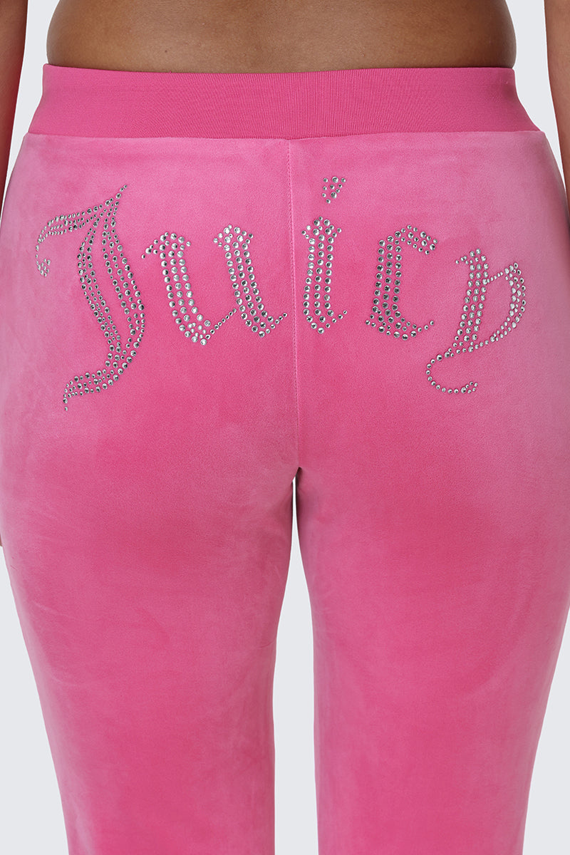 Close-up of the back of the OG Big Bling Velour Track Pants in pink, featuring a dazzling rhinestone Juicy embellishment across the seat—a true Y2K style statement.