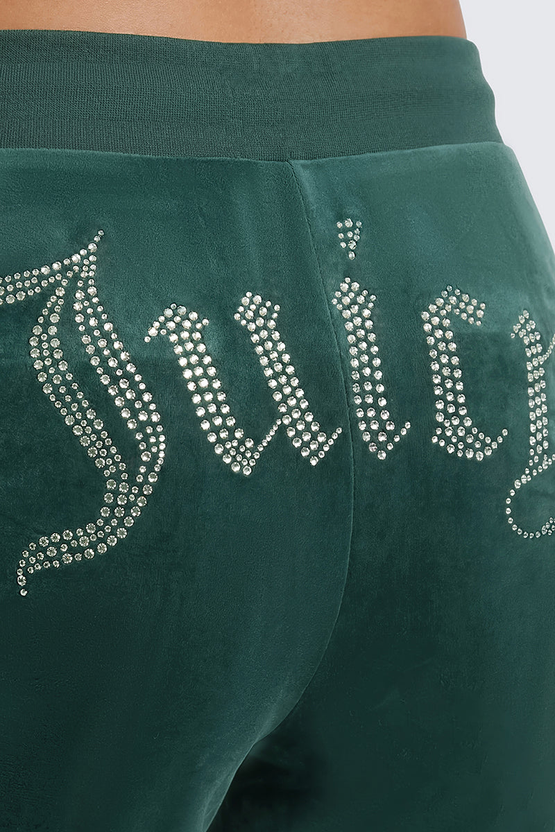 Close-up of the Plus-Size OG Big Bling Velour Track Pants in green, featuring “Juicy” spelled out in rhinestones across the back for an iconic Y2K style.