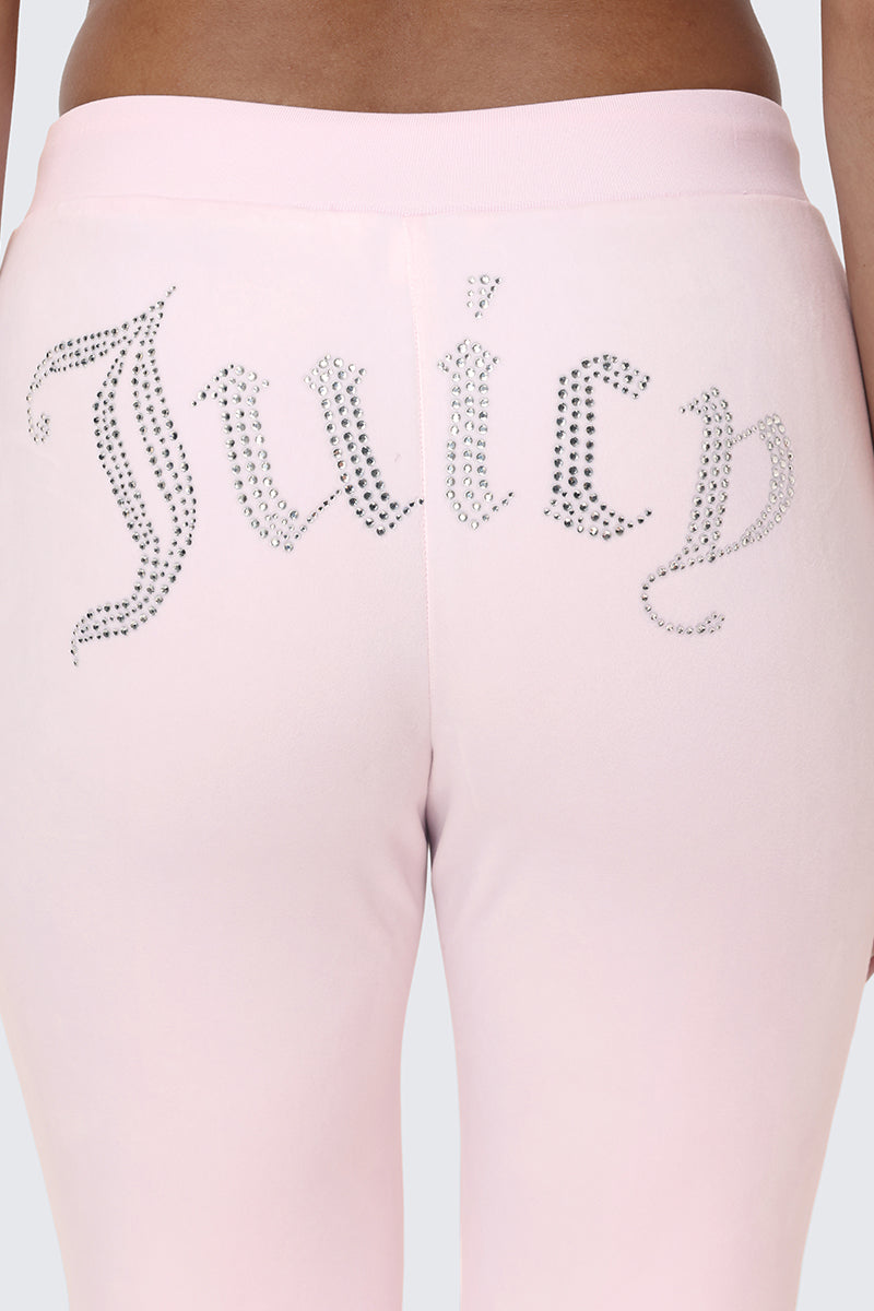 Close-up of the back of OG Big Bling Velour Track Pants in pale pink, featuring rhinestone Juicy embellishment across the seat—a classic Y2K style statement.