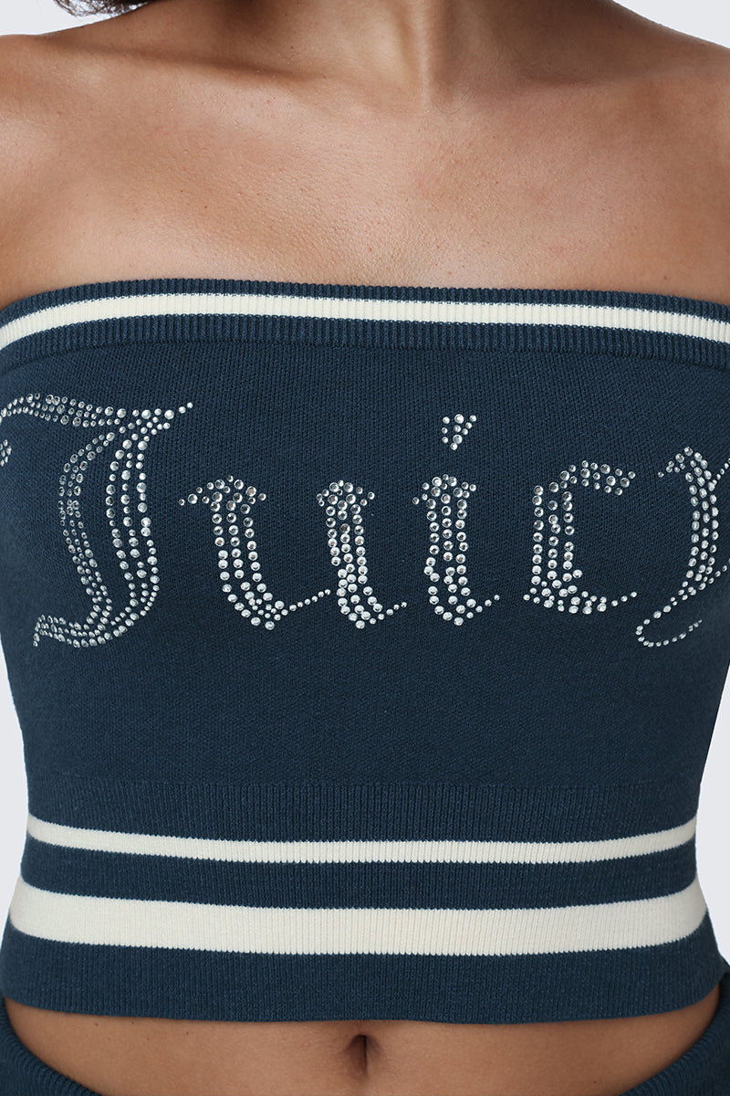 A person wearing a dark blue, strapless Big Bling Tube Top featuring white stripes and a rhinestone logo spelling Juicy across the chest.