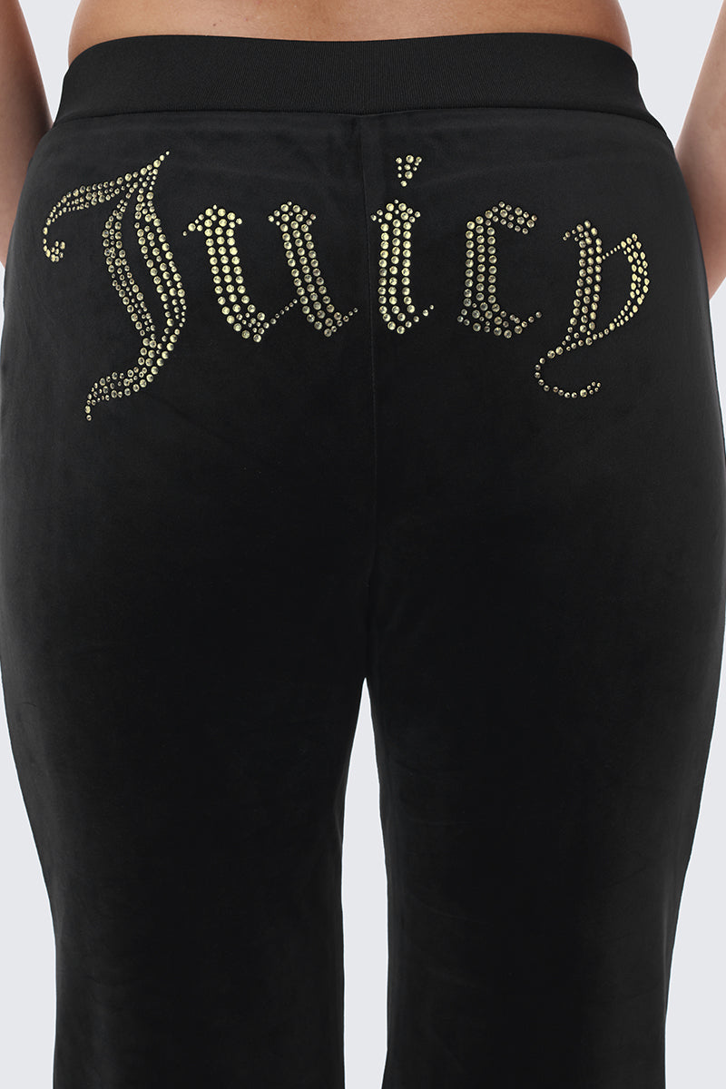 OG Big Bling Ribbon Track Pants in black, featuring the word Juicy spelled out in gold rhinestones across the back.