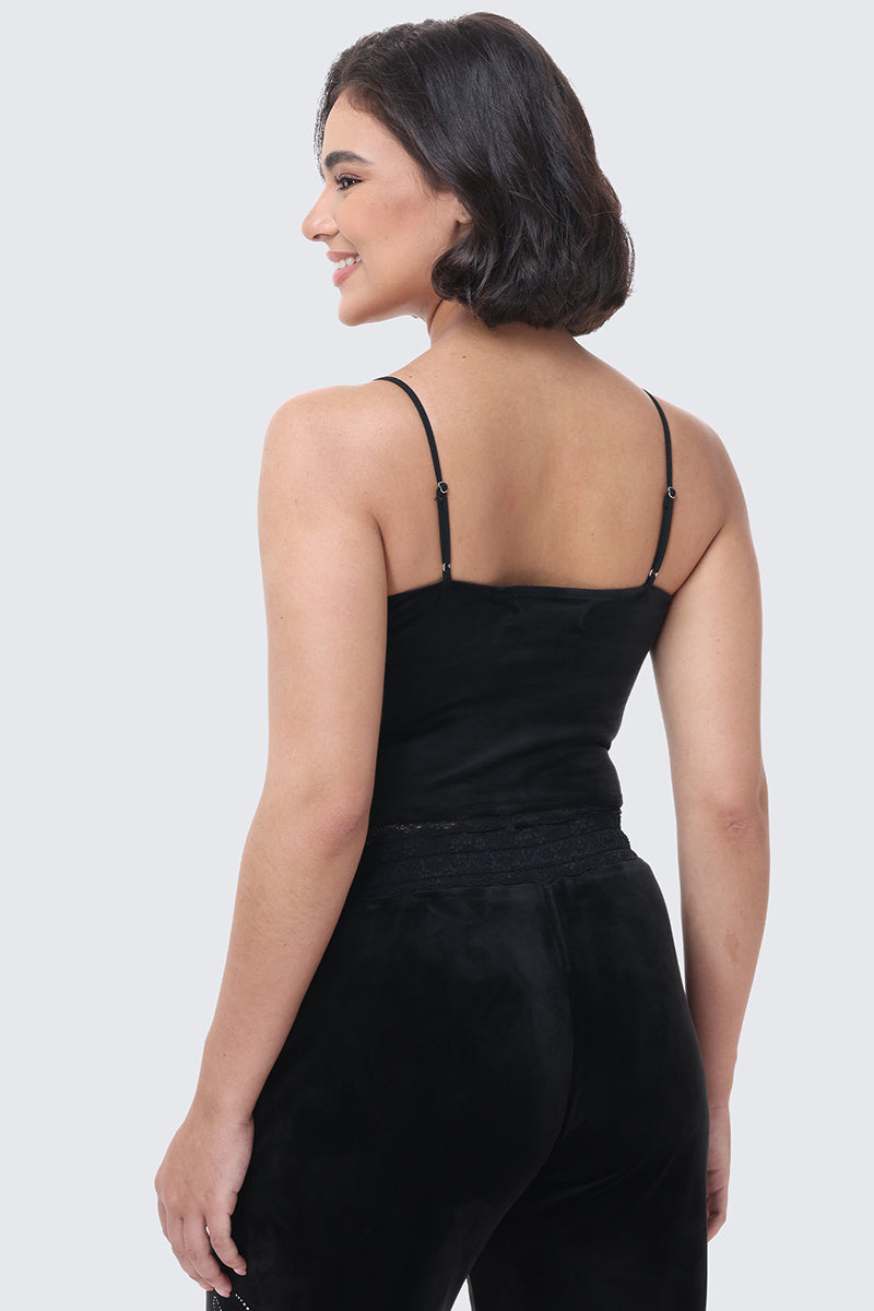 A person viewed from the back wearing a black, Y2K-inspired Small Bling Cropped Cami with thin spaghetti straps and lace trim.