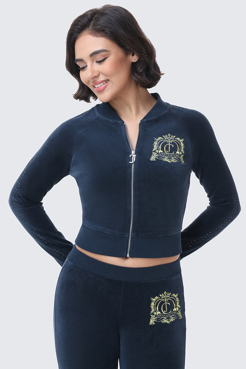 The Scottie Crown Cotton Velour Jacket is a navy blue luxe cotton velour bomber jacket featuring a gold crown crest on the chest.