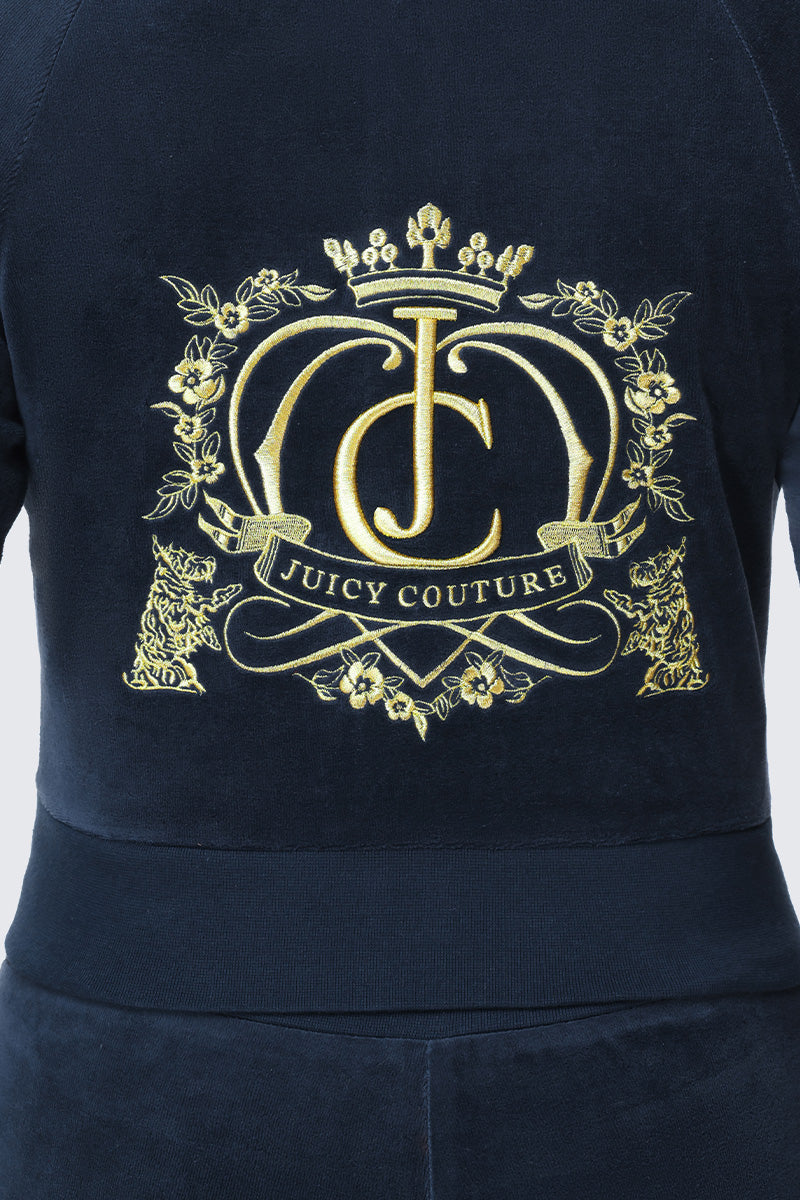 Dark blue Scottie Crown Cotton Velour Jacket in cotton velour with an ornate gold embroidered crest featuring a crown, the initials JC, and the text JUICY COUTURE.