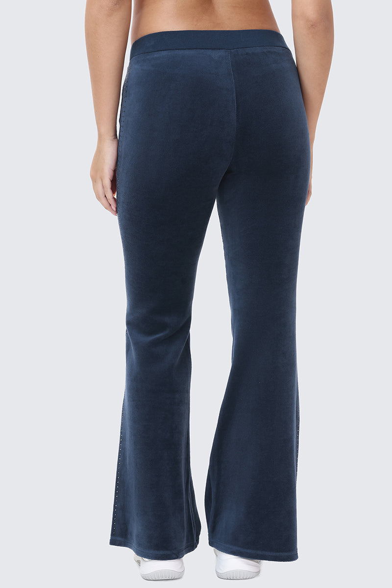 Back view of dark blue Scottie Crown Cotton Velour Track Pants with a slight flare at the hem.