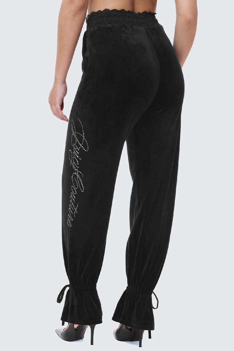 Black Small Bling Velour Track Pants featuring a lace trim waistband, rhinestone lettering on the leg, and tie-cuff ankles.