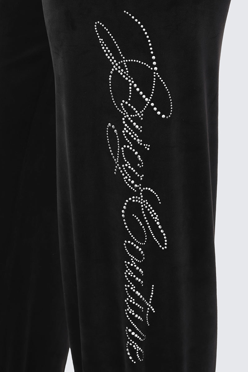 Small Bling Velour Track Pants in black velour, featuring a vertical rhinestone logo written in script.
