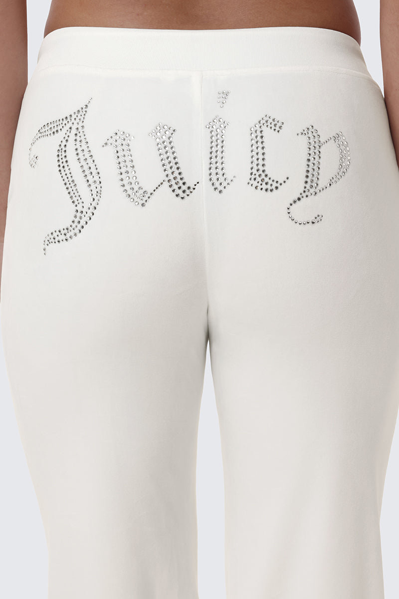 OG Big Bling Velour Track Pants in white velour with the word Juicy in rhinestone embellishment across the back.