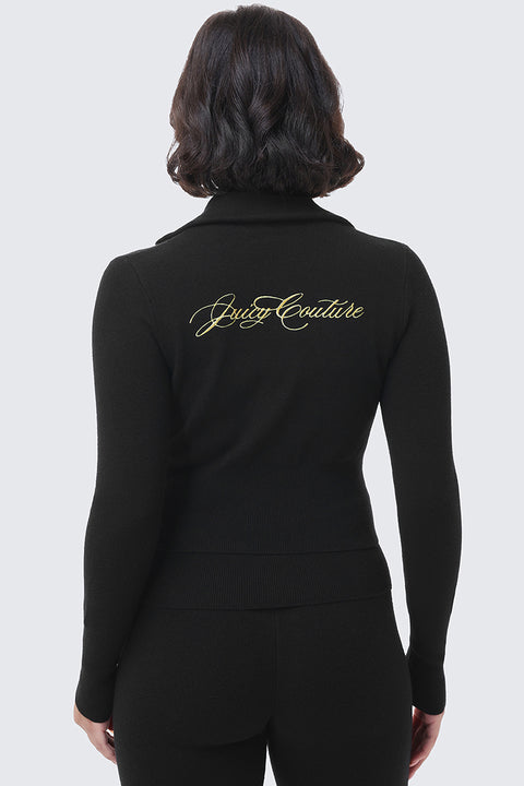 Back view of a person wearing a black long-sleeved Embroidered Knit Cropped Jacket featuring the Juicy Couture brand name embroidered in gold script across the upper back.