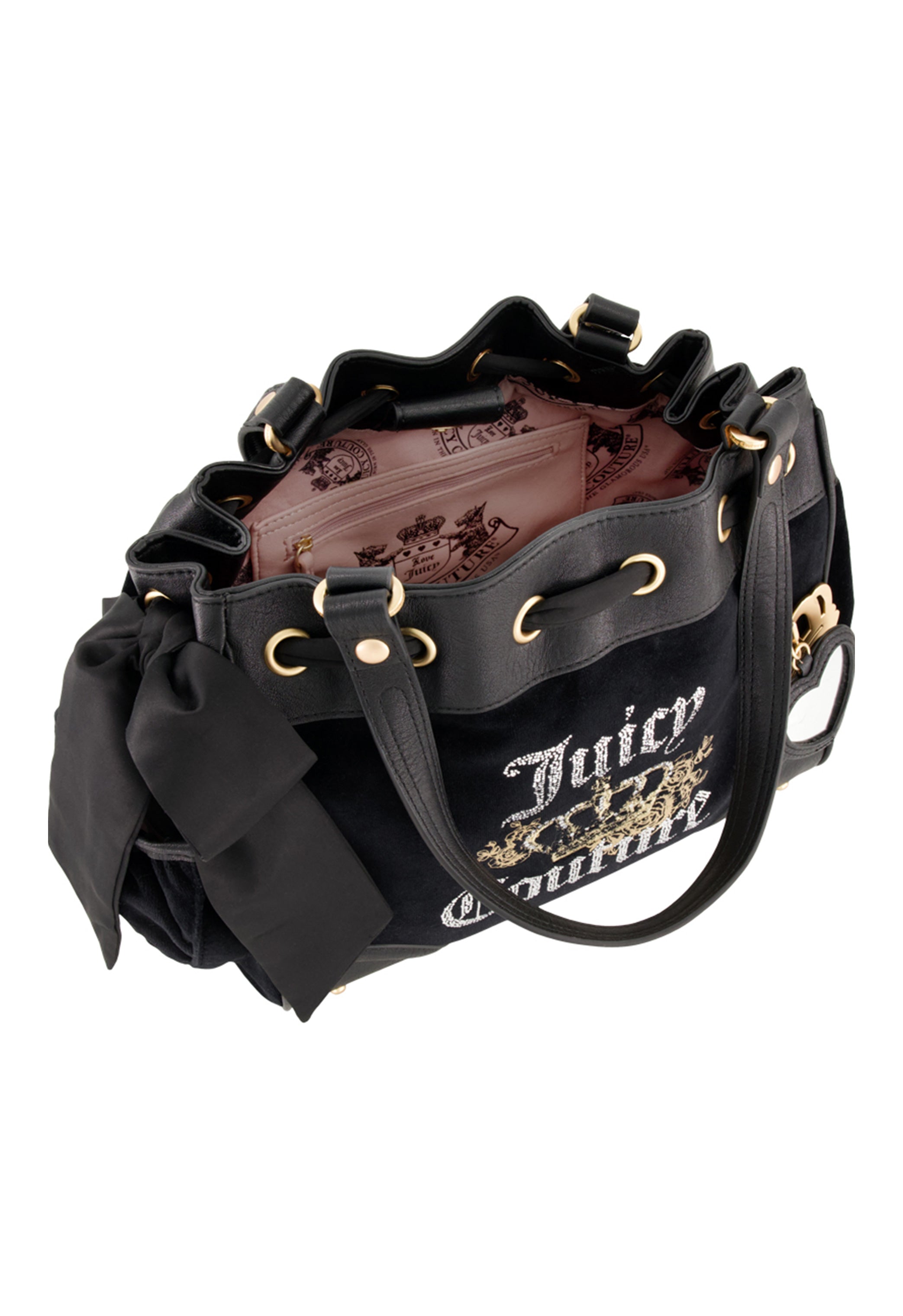 The Juicy Couture Royal Bloom Daydreamer Tote Bag is black with gold accents, a large side fabric bow, and pink printed interior lining. Its open top reveals a roomy inside with a zippered pocket for glamorous organization.