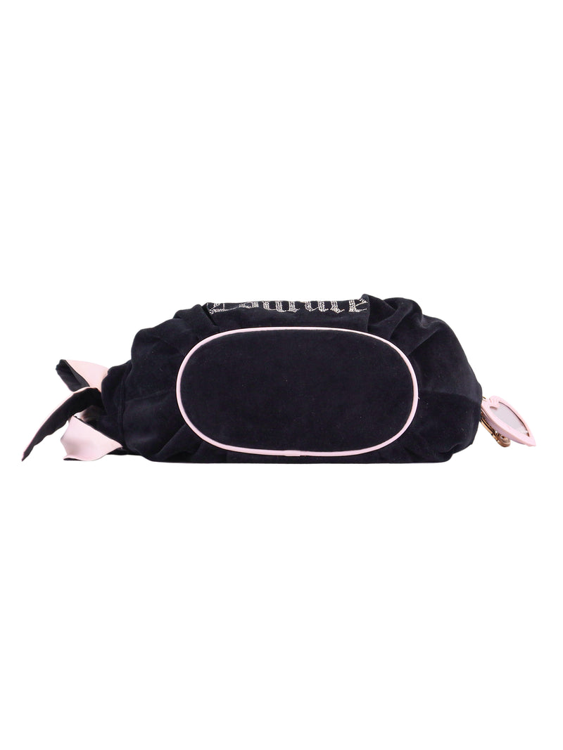 The Royal Bloom Hobo Bag in black with light pink trim is shown lying flat, highlighting its oval-shaped bottom and top zipper closure—perfect for everyday use.