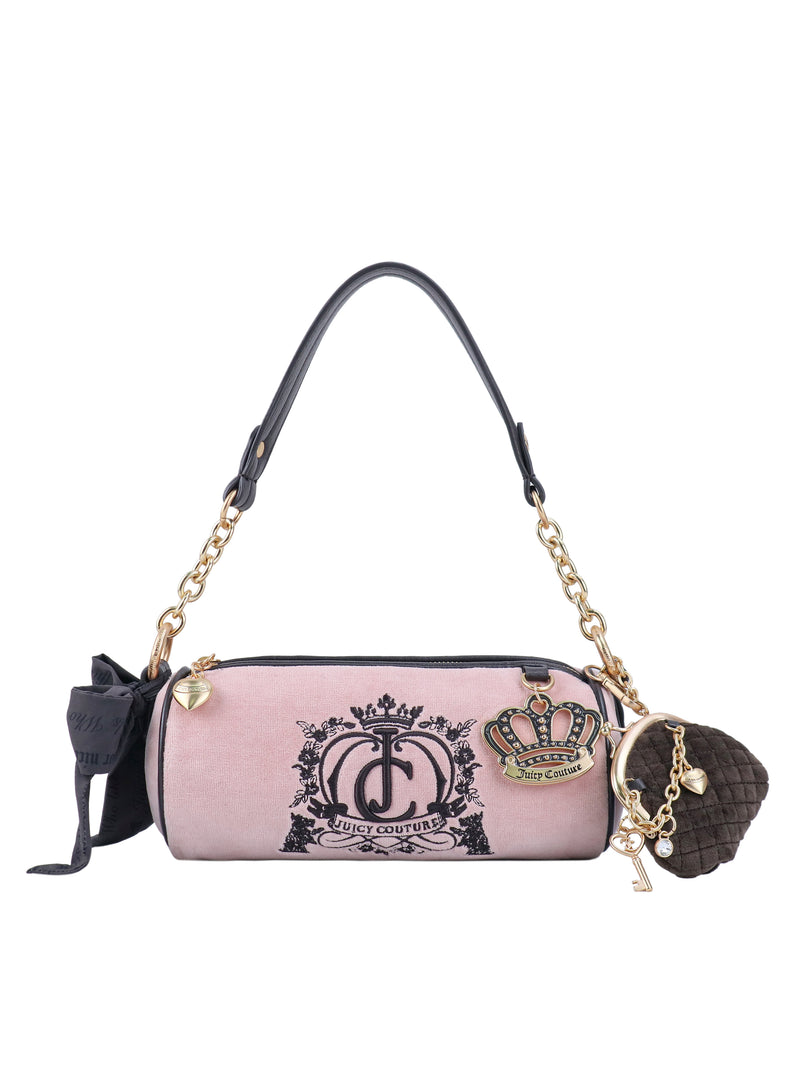 Pink cylindrical Crowns & Kisses Shoulder Bag featuring a black logo, gold chain strap, and crown, heart, and pom-pom charms, offering a touch of feminine nostalgia.