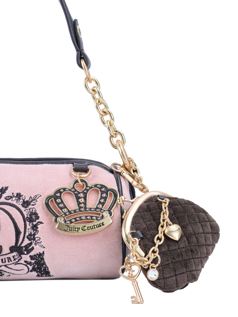 Crowns & Kisses Shoulder Bag featuring a pink cylindrical silhouette, black crown emblem, gold chain strap, and a brown heart-shaped coin purse, evoking a sense of feminine nostalgia.