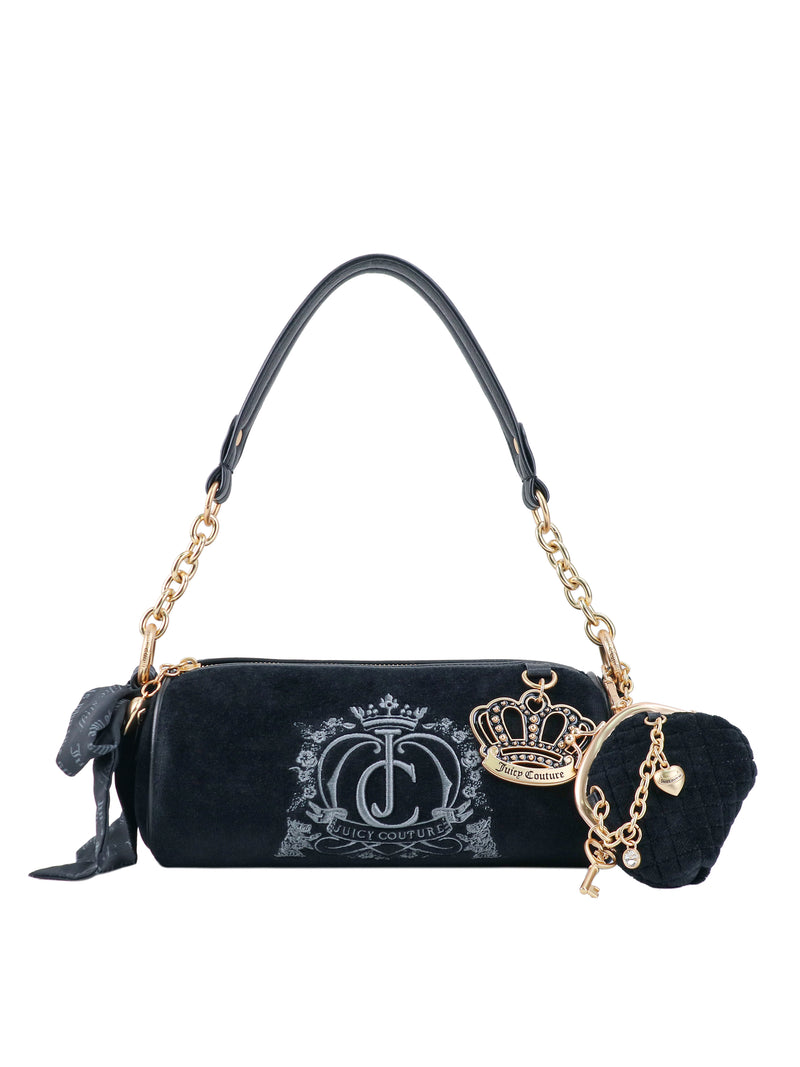 Crowns & Kisses Shoulder Bag: a black cylindrical bag with a large silver logo, gold chain strap, crown charm, and heart-shaped coin purse, capturing a sense of feminine nostalgia.