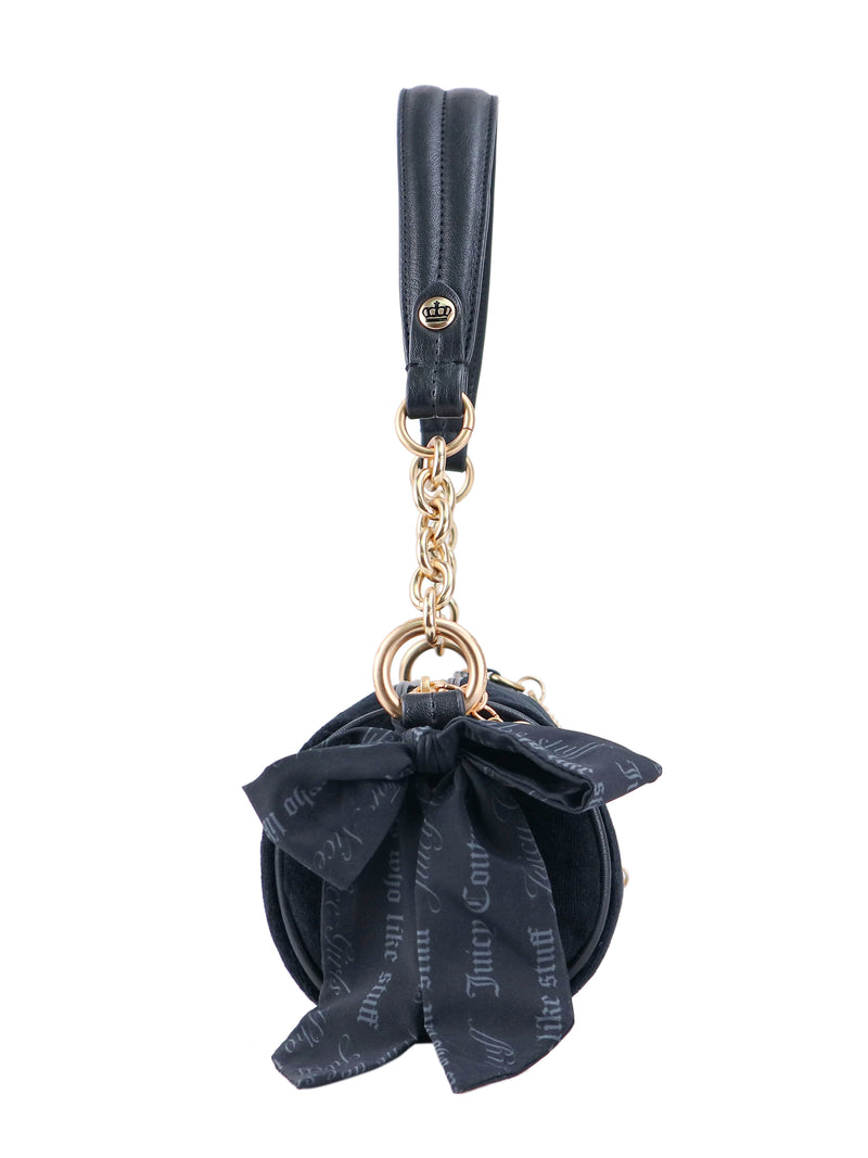 Crowns & Kisses Shoulder Bag in black, featuring a round silhouette, a gold chain strap with crown motifs, and a decorative ribbon bow.
