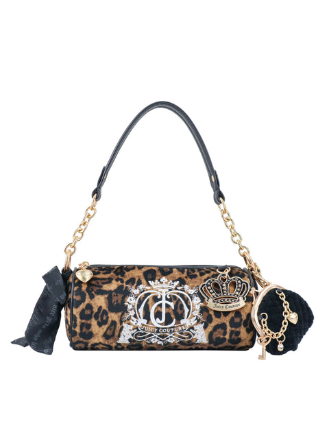 The Crowns & Kisses Shoulder Bag is a cylindrical leopard-print bag with a white logo crest, a crown motif, black accents, a shoulder strap, a decorative ribbon, and a pom-pom charm that evokes feminine nostalgia.