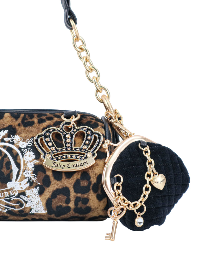 Crowns & Kisses Shoulder Bag in leopard print with a gold chain strap, featuring a metal crown charm and a small, black quilted coin purse attached by a gold chain with heart and key charms, evoking a sense of feminine nostalgia.
