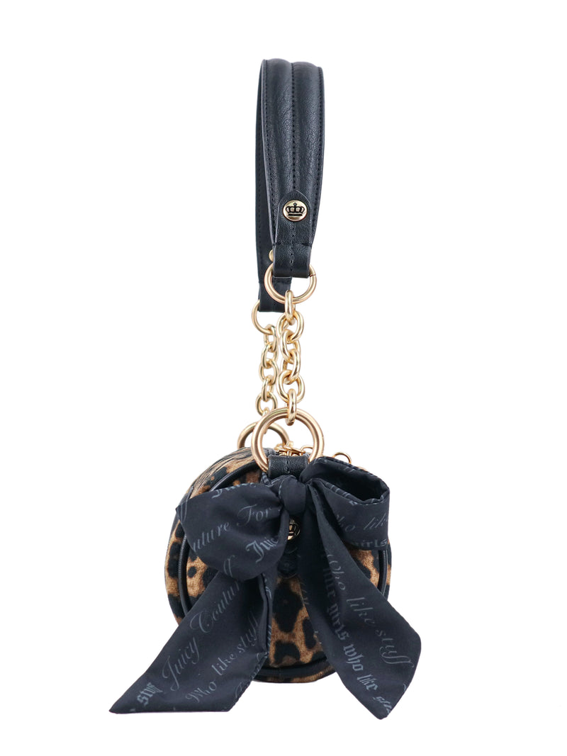 Crowns & Kisses shoulder bag in a round, leopard-print design featuring a black bow and gold-tone chain strap, capturing feminine nostalgia in its classic silhouette.