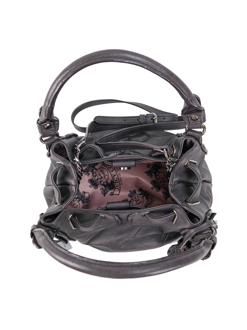 Top-down view of a dark gray Twist & Shout Crossbody Bag with a slouchy, open top revealing a pink patterned interior lining.