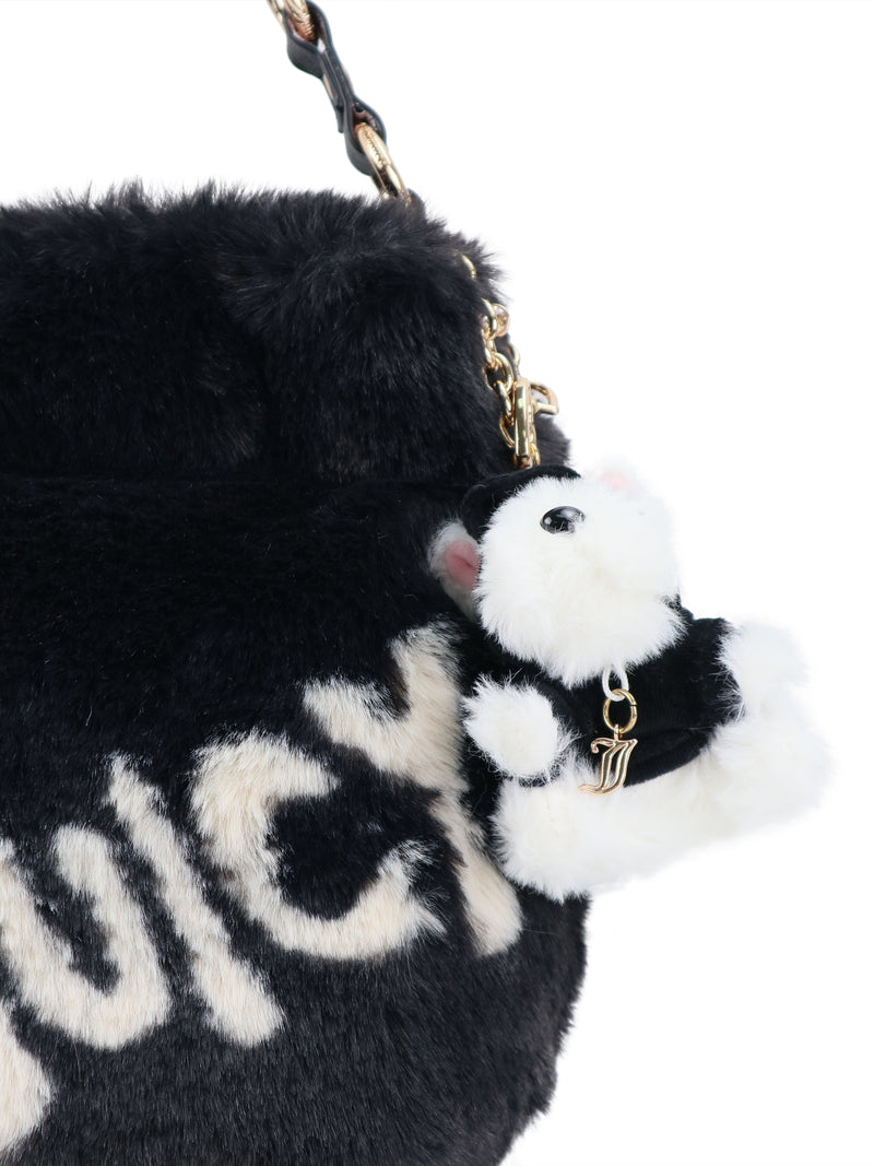 Black faux fur Viva La Juicy Hobo Bag with white lettering and a fluffy black and white stuffed animal keychain, offering a touch of glamour in an everyday silhouette.