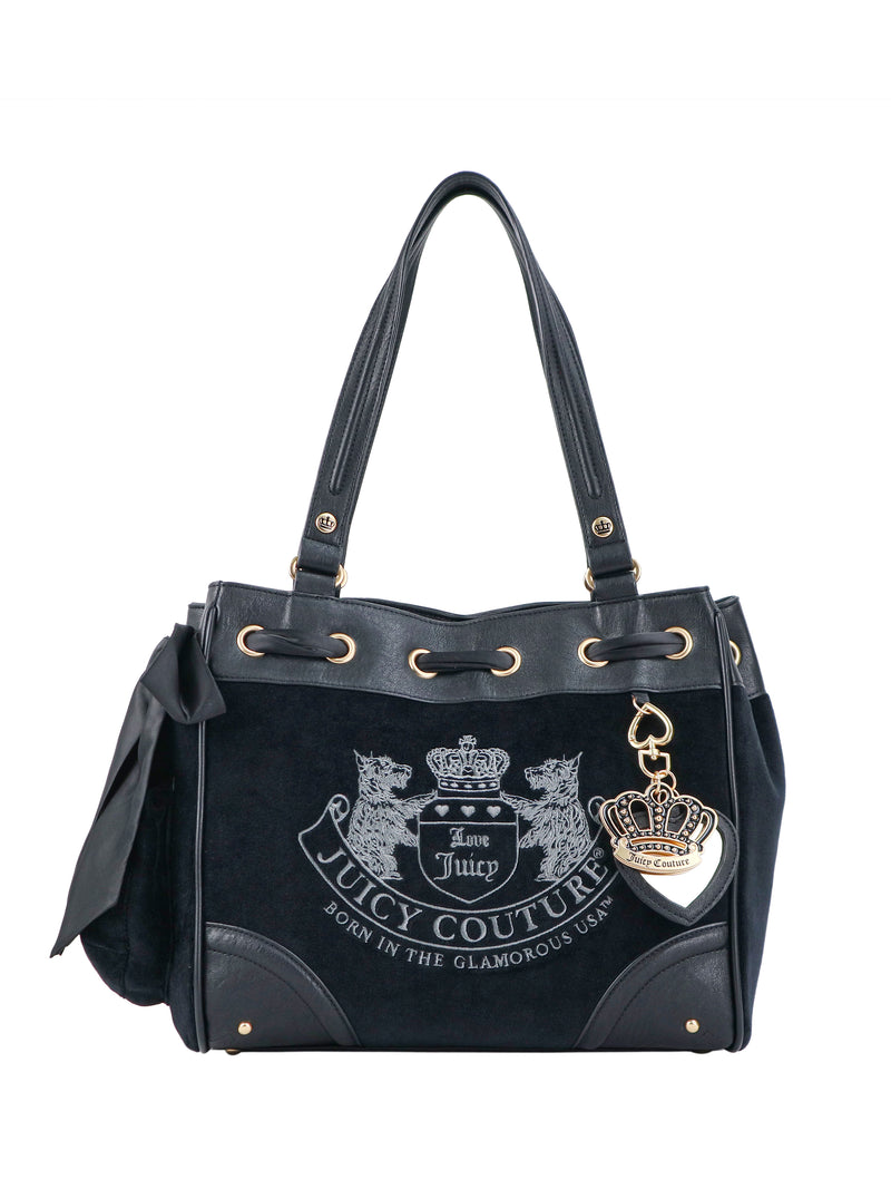 Scottie Heritage Daydreamer tote bag in black polished leather with gold-tone hardware, a side bow, and a large embroidered logo featuring a Scottie motif and a crown.