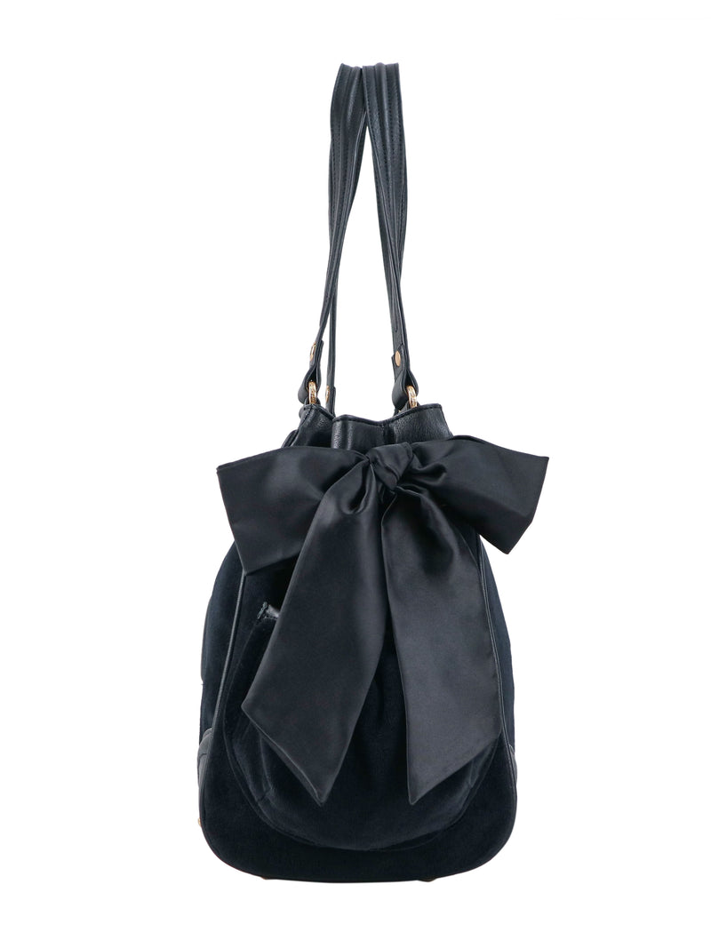 Scottie Heritage Daydreamer tote bag in black polished material with two shoulder straps, a large decorative bow on the front, and a signature Juicy charm.