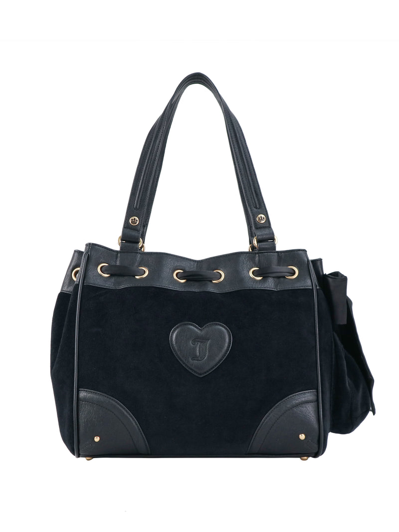 Scottie Heritage Daydreamer Tote Bag in black polished leather with gold-tone hardware, featuring a front heart-shaped patch with a Scottie motif and a top drawstring detail.
