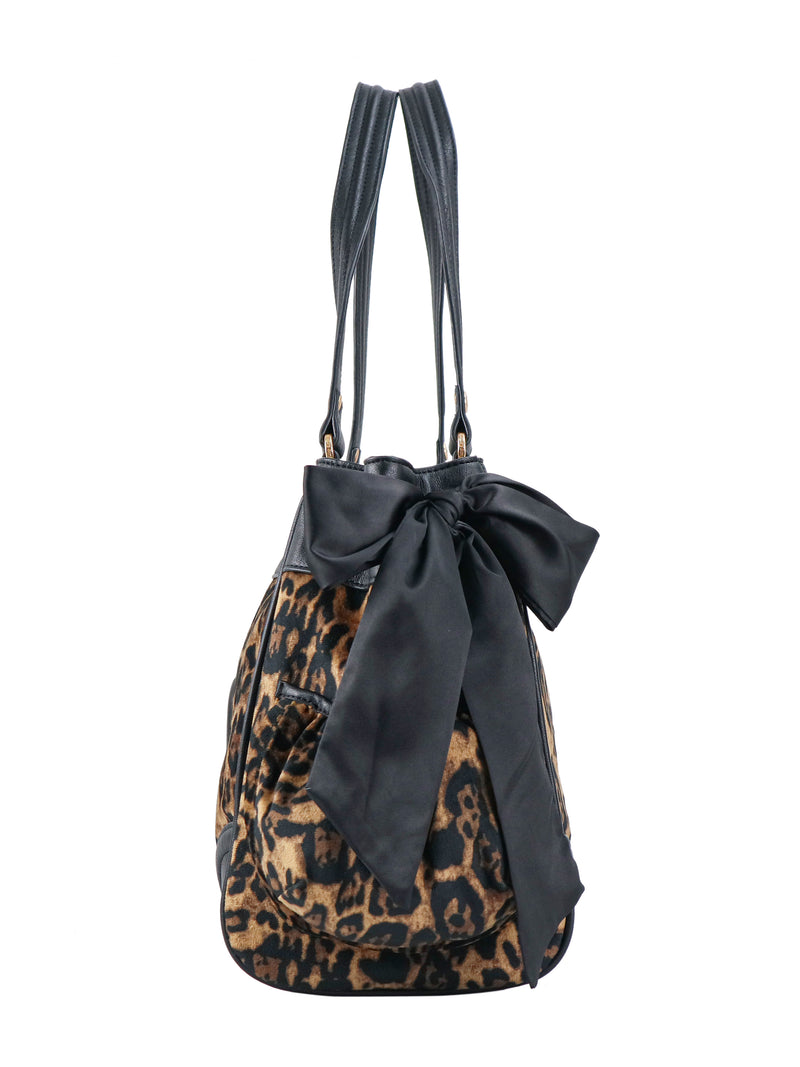 Scottie Heritage Daydreamer Tote Bag in leopard print with black handles, a large black front bow, and a Juicy charm and Scottie motif.