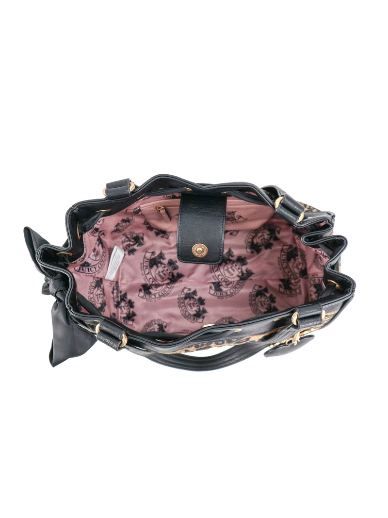 Open black polished Scottie Heritage Daydreamer Tote Bag with a pink interior lining featuring a repeating Scottie motif and a gold magnetic snap closure.