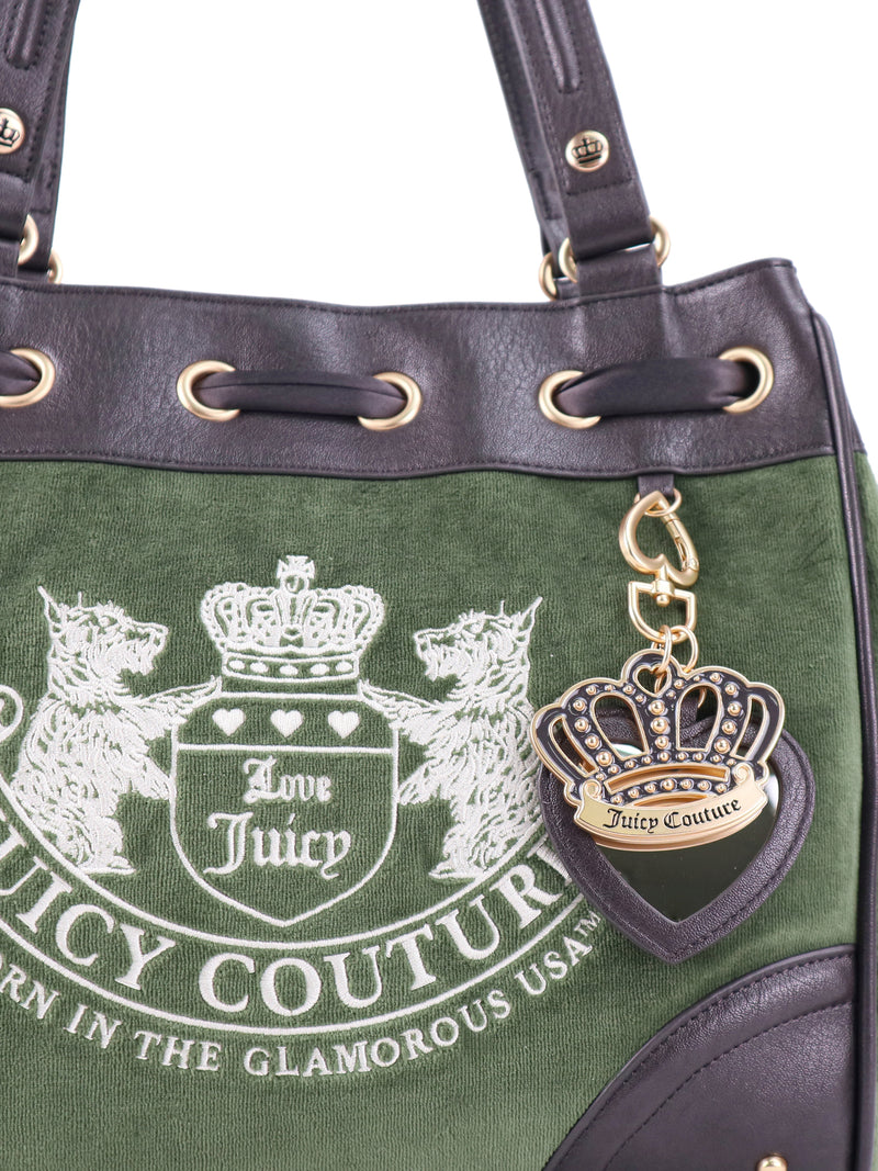 Olive green velour Scottie Heritage Daydreamer tote bag featuring an embroidered Scottie motif crest and a dangling gold-tone crown and heart Juicy charm.