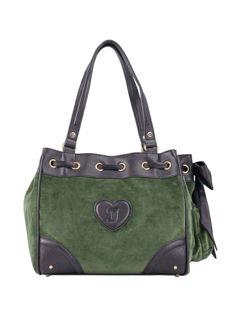 Scottie Heritage Daydreamer tote bag in green velour with black leather trim, a heart-shaped Scottie motif emblem, drawstring top, and a side bow.