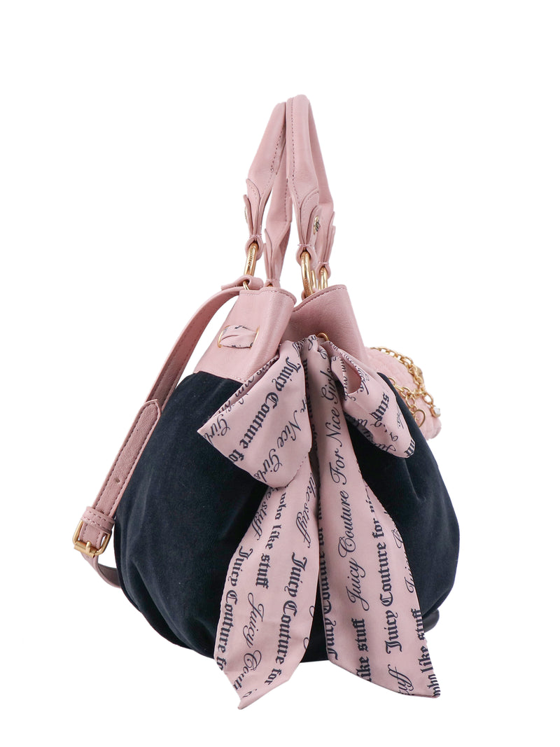Black Crowns & Kisses Satchel Bag with pink handles, a crossbody strap, and a pink scarf tied in a bow featuring repeating text, offering a statement-making silhouette.