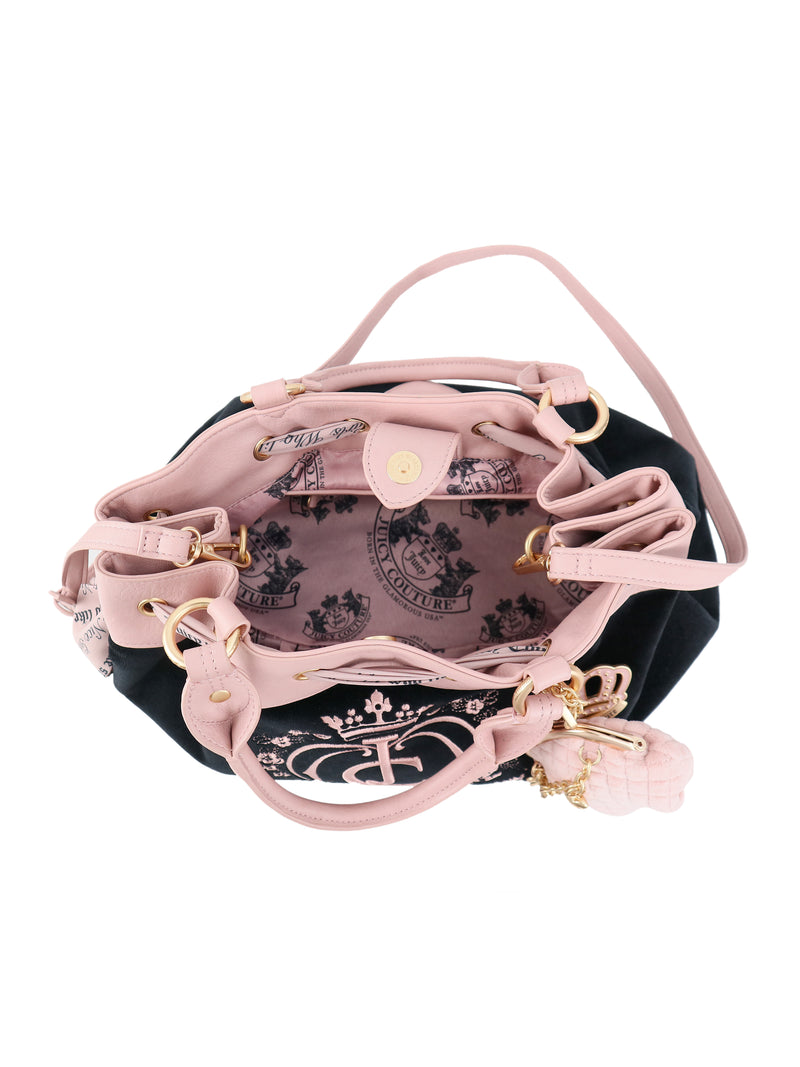 Crowns & Kisses Satchel Bag in black and pink Y2K style with a drawstring closure, light pink handles, and a branded interior lining.