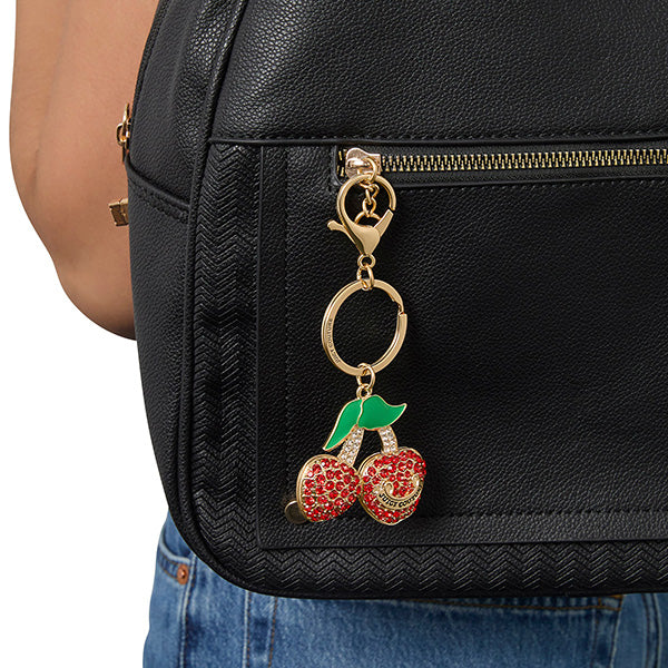 Black backpack with a cherry keychain attached