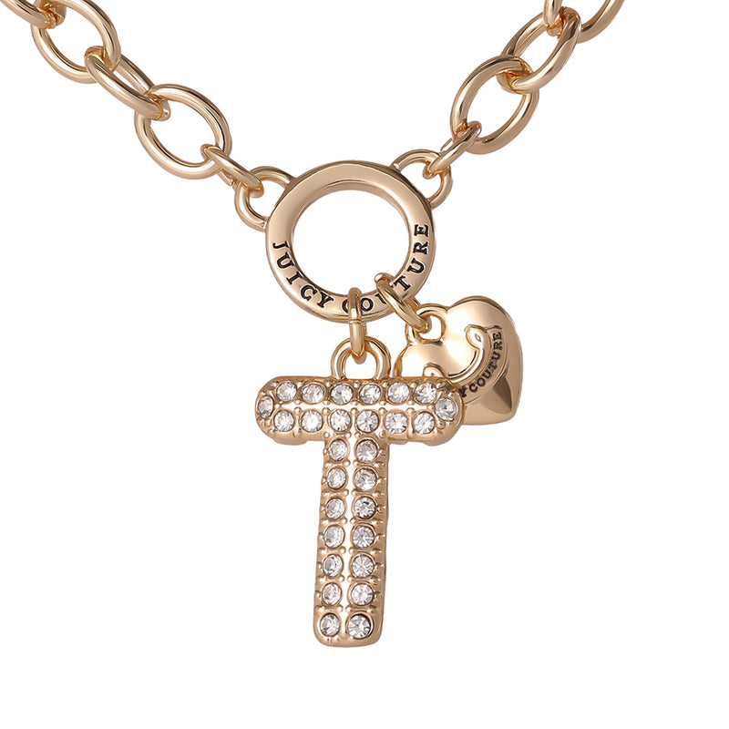The Bubble Initial Necklace, Letter T features a gold chain adorned with a crystal-studded bubble letter “T” charm and a small gold heart engraved with Juicy Couture, bringing playful Y2K style and personalized elegance to any outfit.