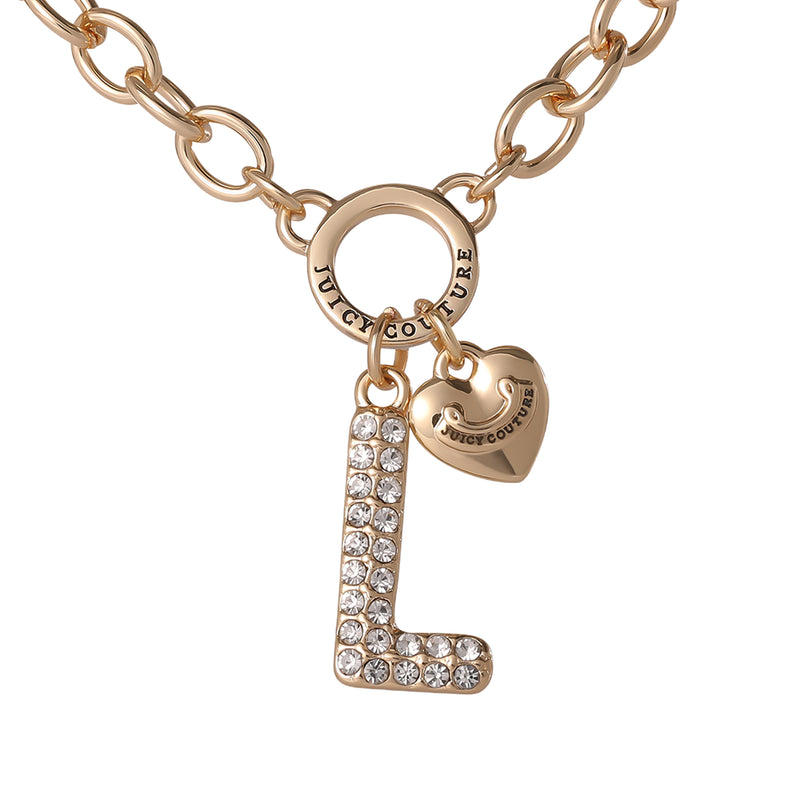 The Bubble Initial Necklace, Letter L features a gold chain with a bold, crystal-studded bubble letter “L” pendant and a dainty gold heart charm engraved with Juicy Couture—perfect for adding playful sparkle and Y2K-inspired style to any look.