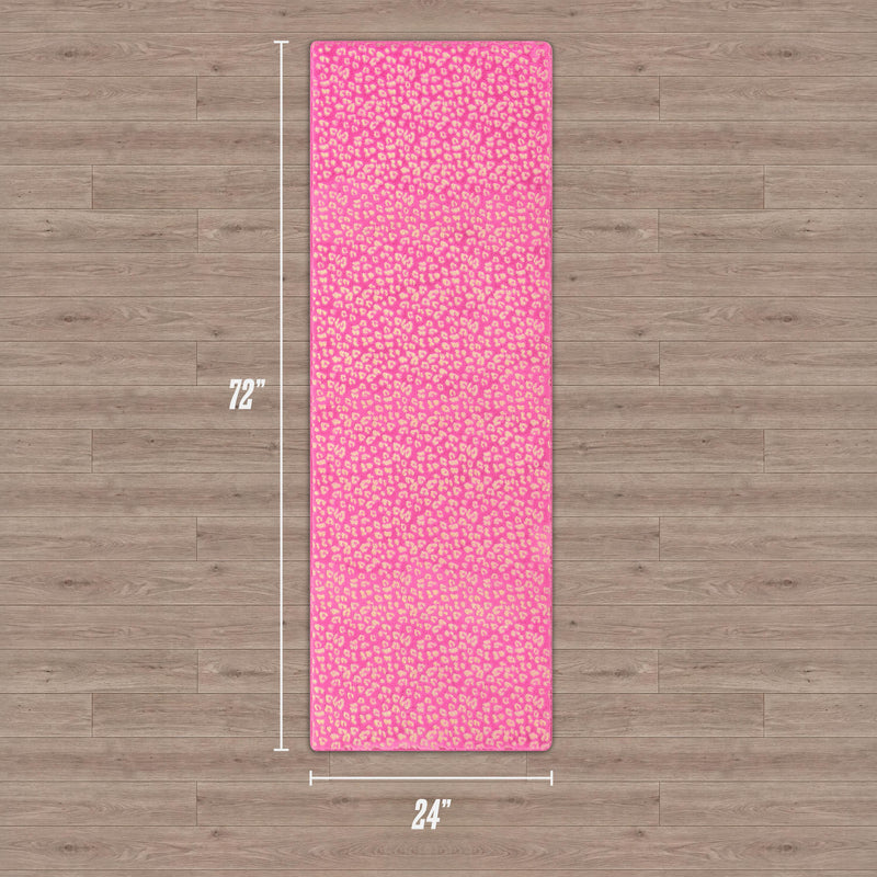 A Metallic Leopard Plush Rug, measuring 2' x 6', lies on a wooden floor. The rug features a bold metallic leopard pattern and soft plush texture, providing both style and comfort to any space.