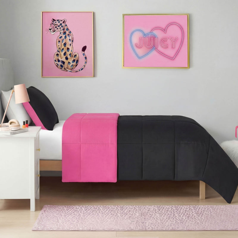 A neatly made bed with black and hot pink bedding sits against a light gray wall. In front of the bed lies a Metallic Leopard Plush Rug, 2' x 6', featuring a bold metallic leopard pattern.