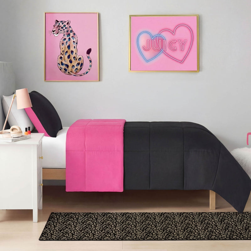 A modern bedroom with a black and hot pink bedspread, white nightstand, Metallic Leopard Plush Rug (2' x 6'), and wall art of a leopard next to a pink JUICY sign with double hearts creates a playful yet stylish atmosphere.
