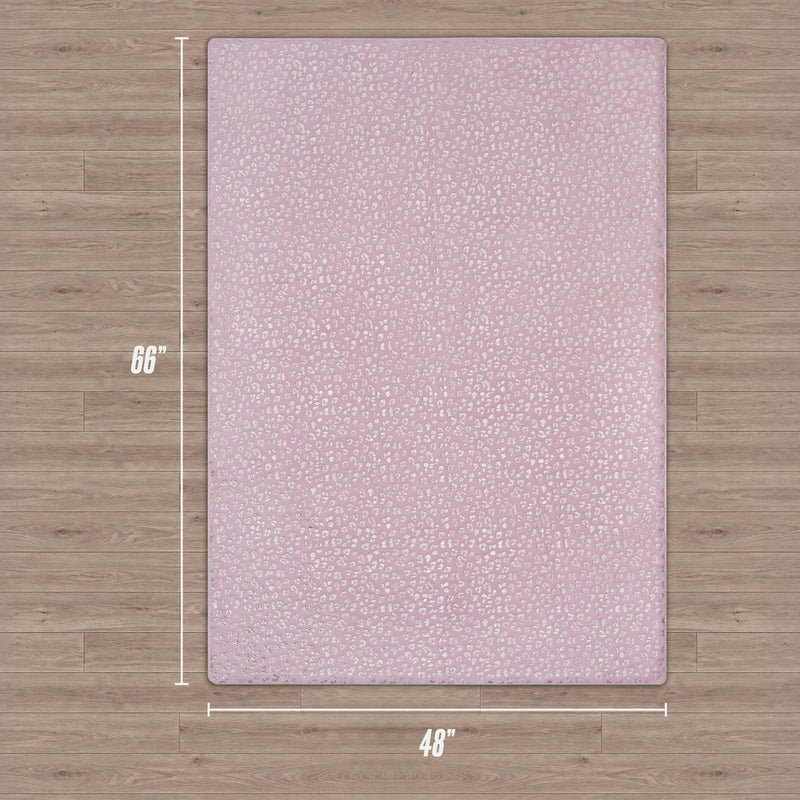 The Metallic Leopard Plush Rug, 4' x 6', in hot pink with a subtle dotted pattern, is displayed on a wood floor. Dimensions are shown alongside the rug’s edges.