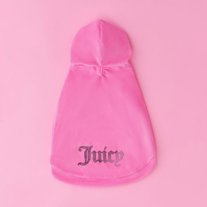 The Bling Velour Pet Hoodie features a pink velour design with a hood and sparkling rhinestone “Juicy” lettering on the back, displayed against a pink background—perfect for adding bling to your designer pet apparel collection.