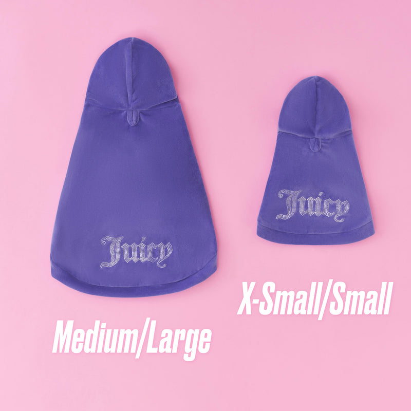 Two Bling Velour Pet Hoodies in purple are displayed on a pink background, with one labeled Medium/Large and the other X-Small/Small. These Juicy Couture hoodies showcase fashionable designer pet apparel, adding a touch of bling and velour flair to your furry friend’s wardrobe.