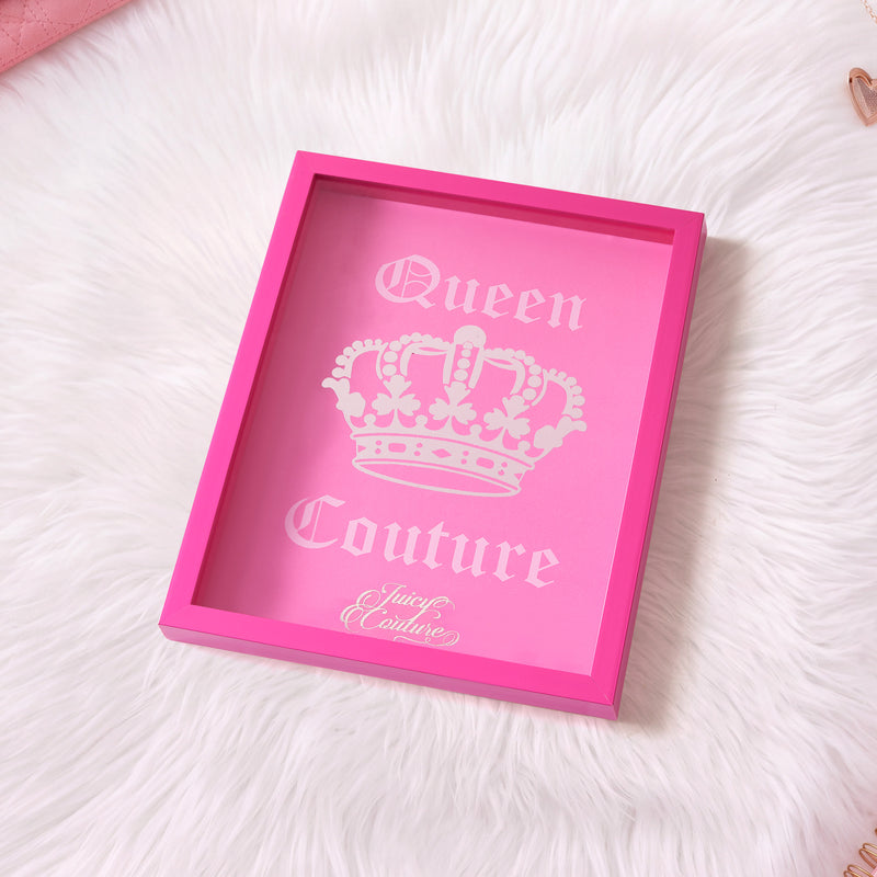 Add a touch of fashion flair to your decor with this Juicy Couture Shadow Box Wall Art (12″ x 16″): it features a vibrant pink tray design adorned with a crown graphic, “Queen Couture” text, and the iconic cursive logo. Displayed on a white furry background, it’s perfect as eye-catching wall art to elevate any space with signature Juicy Couture style.