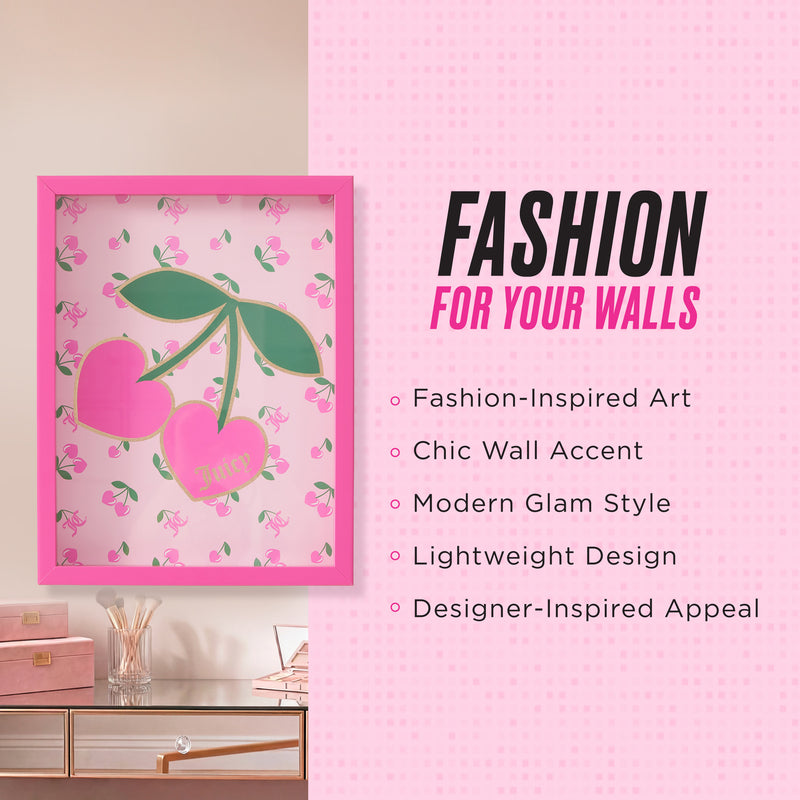 A framed cherry artwork, the Shadow Box Wall Art (12″ x 16″), with a pink border hangs on a pink wall. Text beside it highlights its features: fashion-inspired style, chic wall accent, modern glam, lightweight design, and designer-inspired appeal. This dimensional shadow box art adds depth and interest to any room. Below the artwork are a drawer and books.