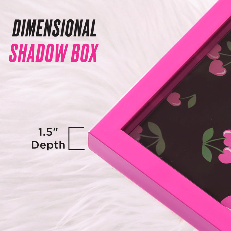 A close-up of the Shadow Box Wall Art, 14″ x 14″, featuring a pink floral design with a dimensional depth of 1.5 inches, displayed on a white furry surface and exuding the chic, fashion-forward charm reminiscent of Juicy Couture wall décor.