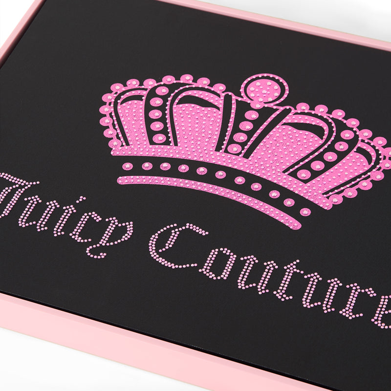 A close-up of a Juicy Couture logo with a pink jeweled crown above the brand name stands out against a black background framed by a light pink border—this elegant Shadow Box Wall Art (16″ x 20″) makes striking Juicy Couture wall décor, perfect for adding fashion-inspired artwork to your space.
